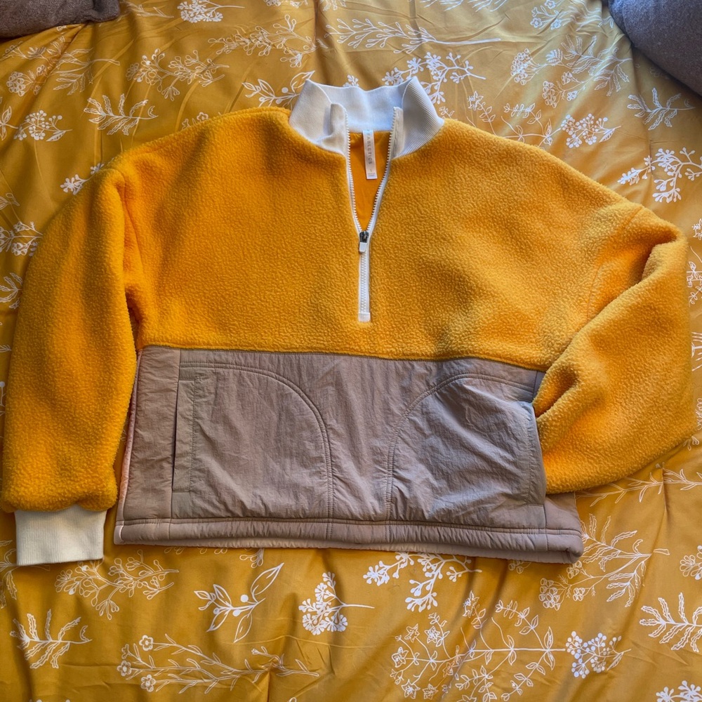 Febletic’s Cropped Yellow Quarter-Zip Sweater